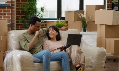 a couple having a discussion after moving in with boxes in the background